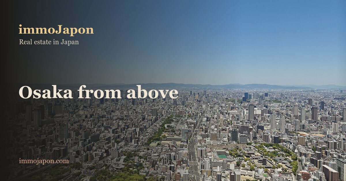Aerial view over Osaka from the Abeno Harukas tower: a sea of small detached houses and low-rise blocks stretching to the hills, cut by straight avenues and punctuated by a few towers, the residential fabric where the city's houses for sale are found