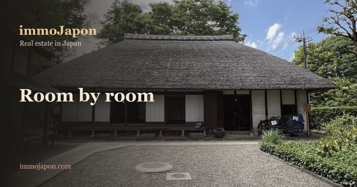 Old Japanese thatched-roof farmhouse with shoji screens opening onto a timber veranda and a raised floor resting on stones, in the grounds of the Itabashi museum in Tokyo